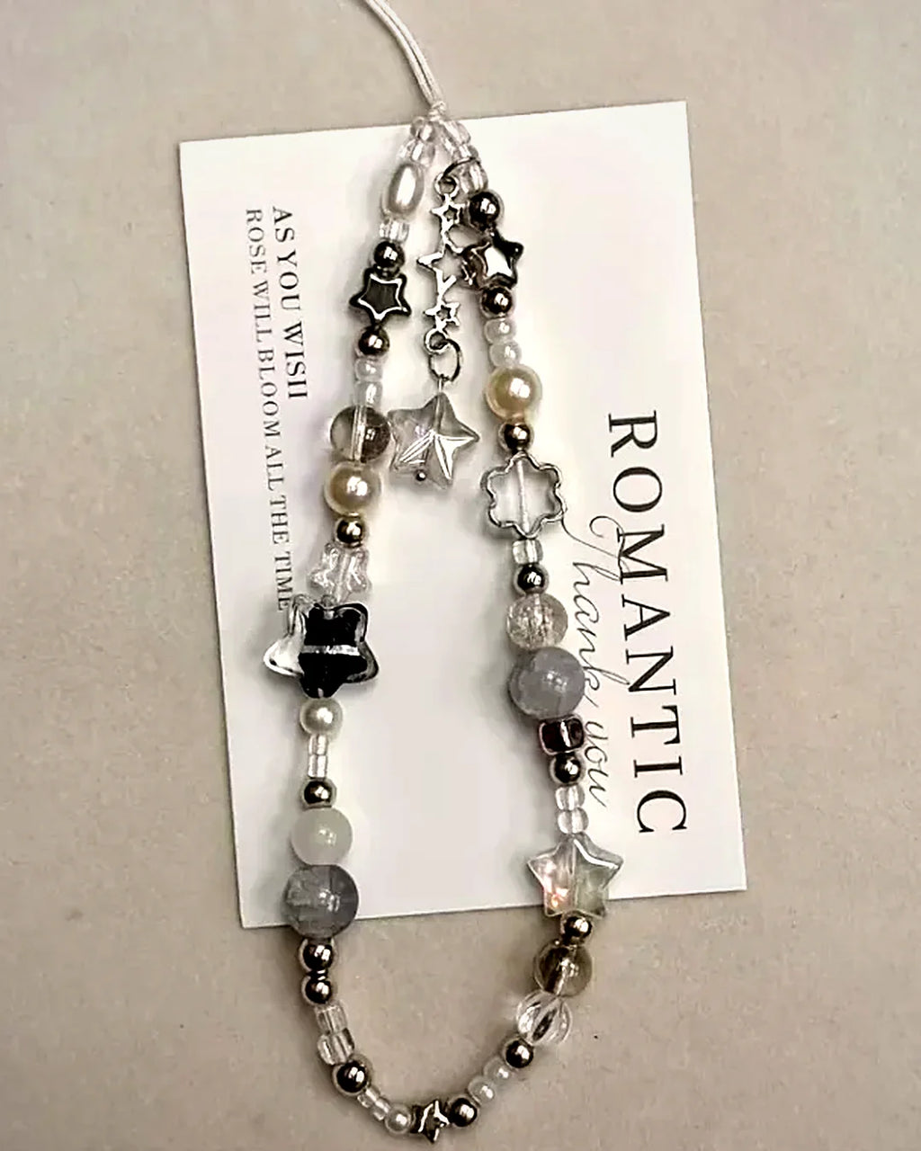 Colgante de móvil con perlas y estrella · Lunares
